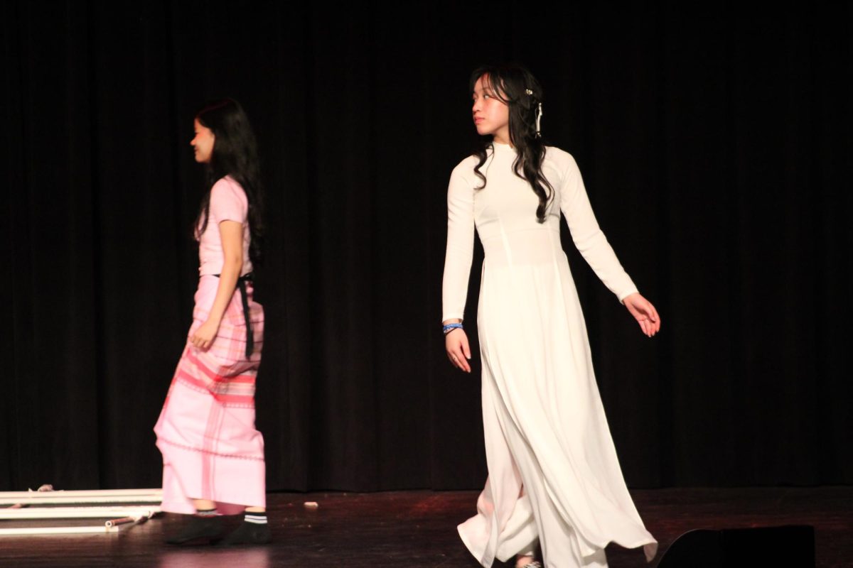 Freshman Sydney Ho modeling an Áo dài, a modernized Vietnamese national garment. 